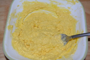 Egg yolk mixture ready to be added to the empty eggs.