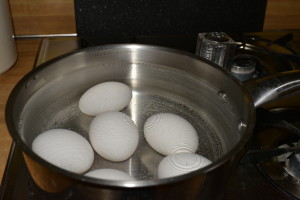 Add eggs to pot of water before you begin to heat.