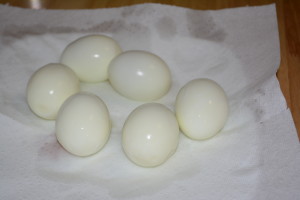 Rinse peeled eggs and pat dry on a paper towel.