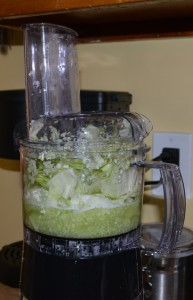 Add chopped cabbage and water to food processor.