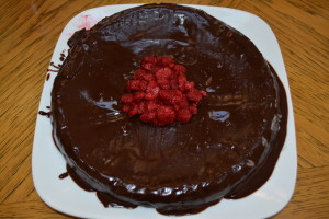 Leave cake uncovered for about an hour to allow glaze to harden. Top with fresh or frozen fruit (I recommend raspberries) to serve.