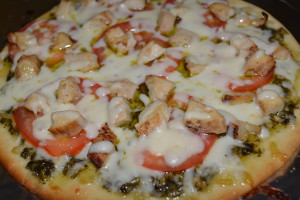Tomato and chicken pesto pizza fresh out of the oven.