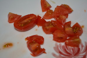 Quarter grape tomatoes or cut large tomatoes into bite-size pieces.