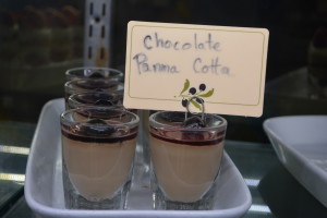 Gluten free Chocolate Panna Cotta topped with cherries.