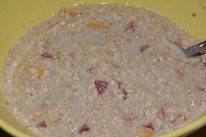 Oatmeal with peaches, strawberries, and bananas.