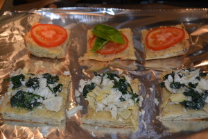 Toast focaccia for 15 minutes at 350 degrees, then top with caprese or spinach artichoke toppings.