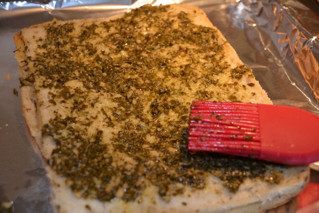 Thin layer of pesto sauce.