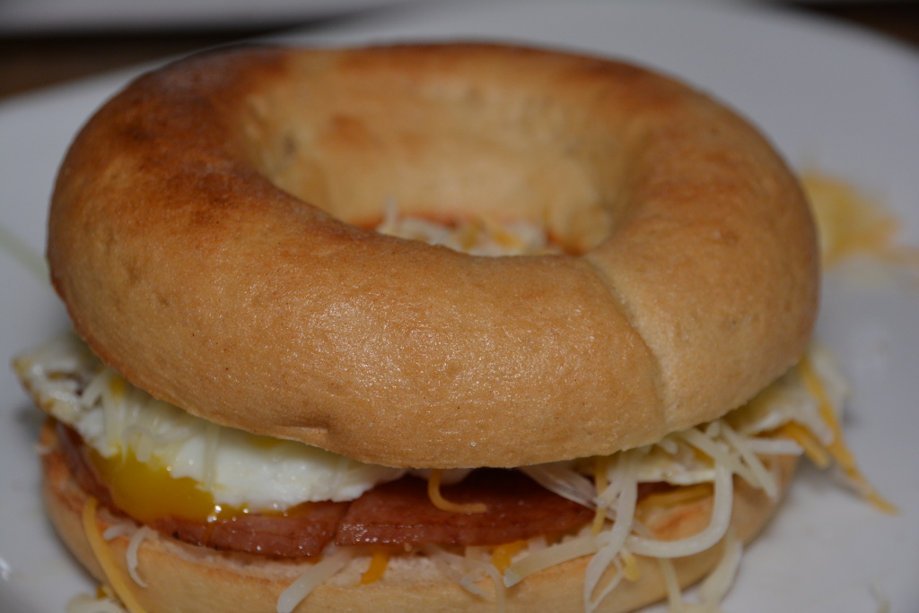 Porkroll, egg, and cheese on a toasted Schar bagel.