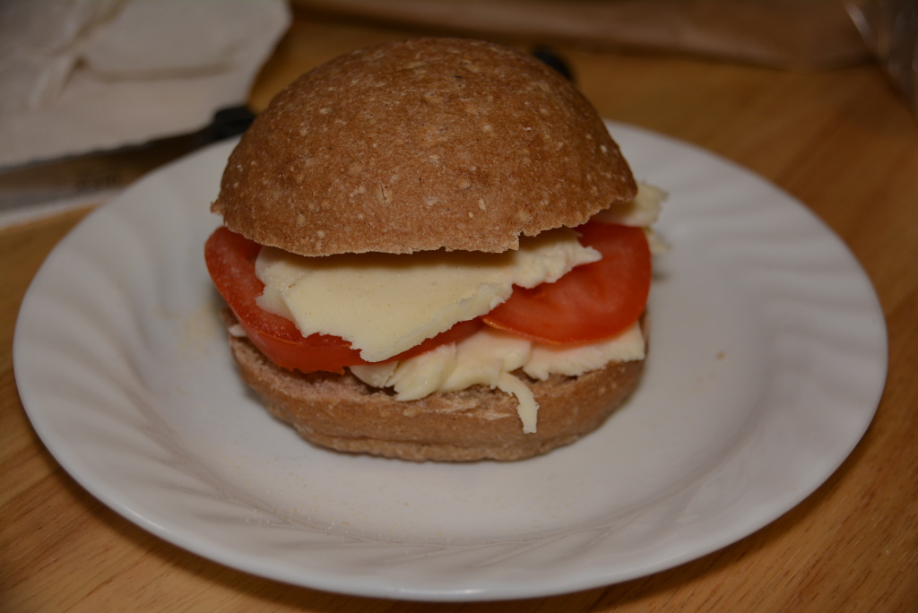 Fresh Mozzarella, Sliced Tomatoes, And A Gluten Free Sourdough Roll