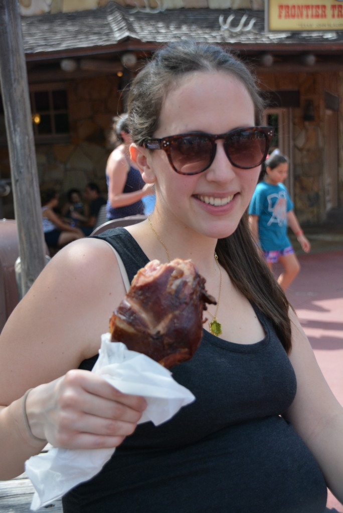 Mommy & baby with a giant turkey leg.