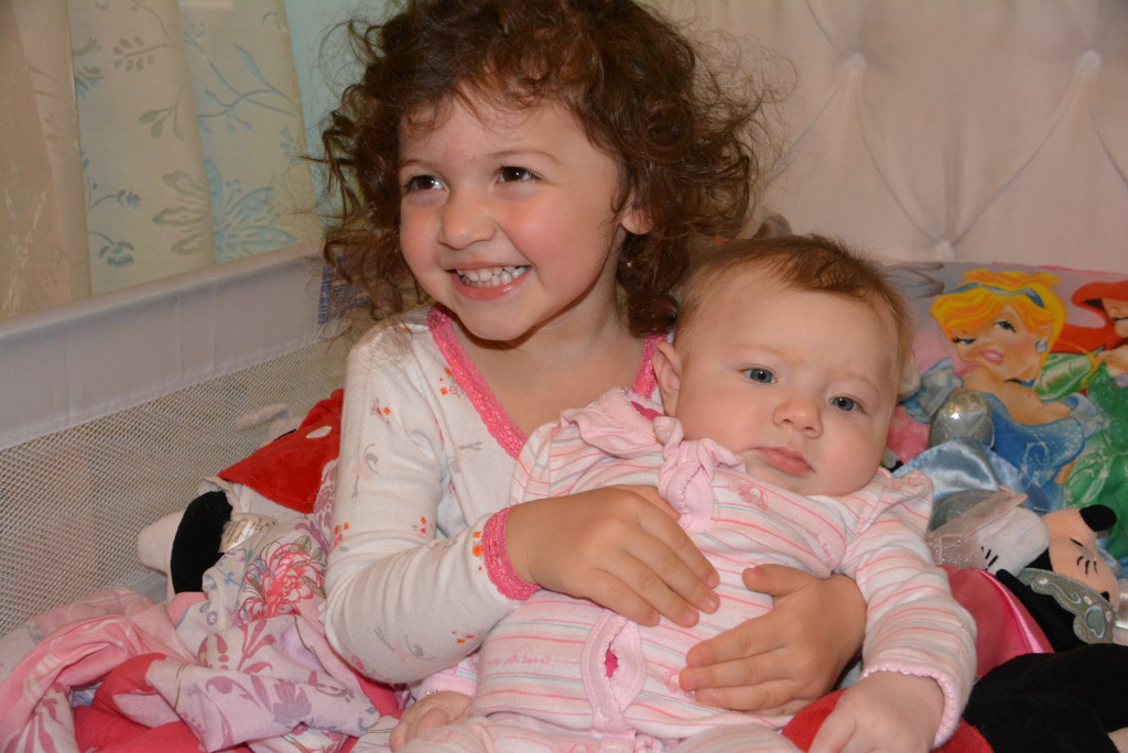 These two little girls love each other so much already. Watching our toddler share her world, and her germs unfortunately, with her little sister has warmed our hearts and we can't believe we're so lucky to be blessed with two such sweet girls!